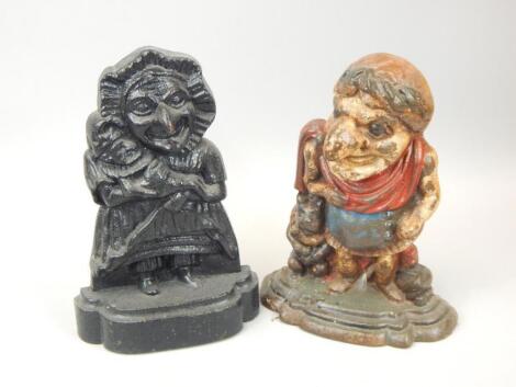 Two cast iron door stops