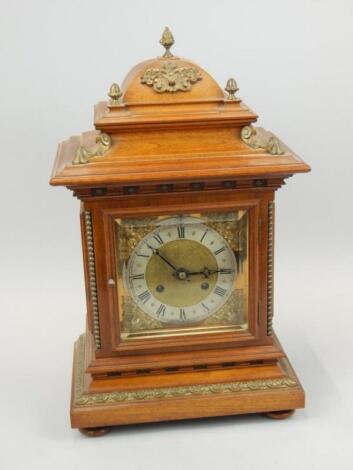 An early 20thC walnut and gilt metal bracket type clock