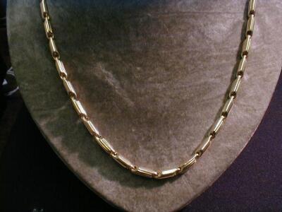 A tube link fancy neck chain by "Anselmini" stamped 750