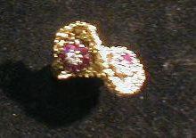 A 1970's style crossover diamond and ruby ring