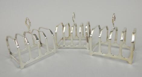 A pair of George V silver four division toast racks