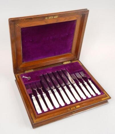 A set of twelve late 19thC / early 20thC silver plated dessert knives and forks