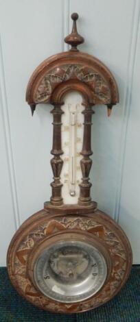 A late Victorian walnut wheel barometer