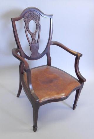 An Edwardian mahogany open armchair