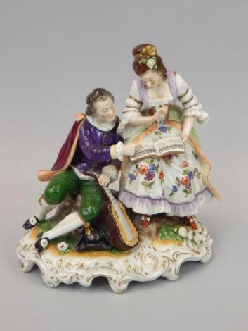 A German porcelain centrepiece in the form of a musician and lady reading music