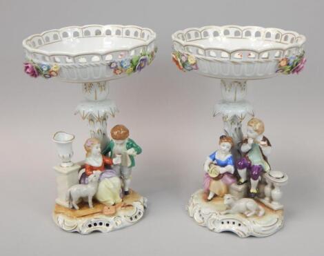 A pair of German porcelain handpainted centrepieces