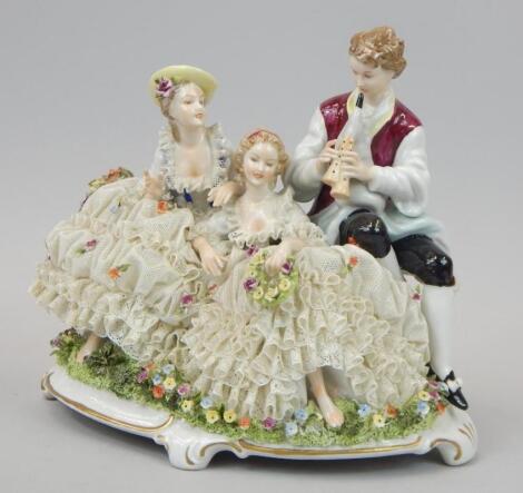 A German Dresden style crinoline figure