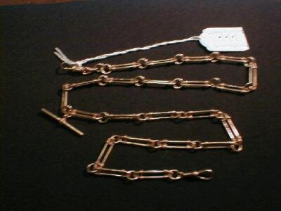 A 9ct rose gold watch chain