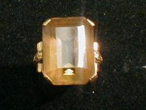 A ladies stone set dress ring