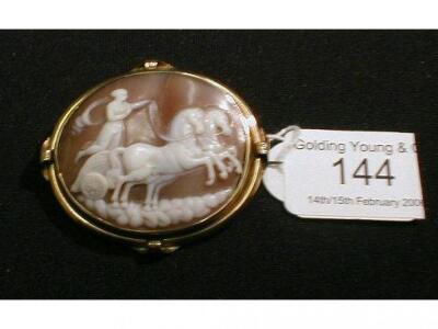 A shell cameo brooch in yellow metal frame