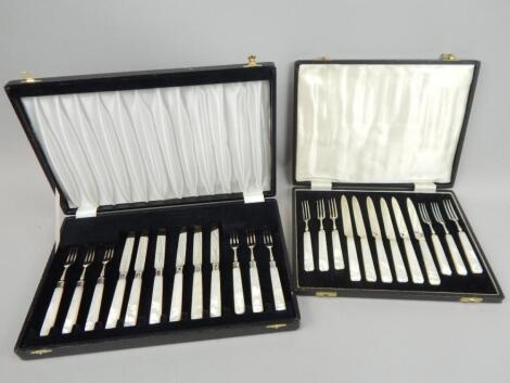 Two sets of six Edwardian silver and mother pearl entree knives and forks