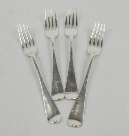 A set of four late William IV silver entree forks