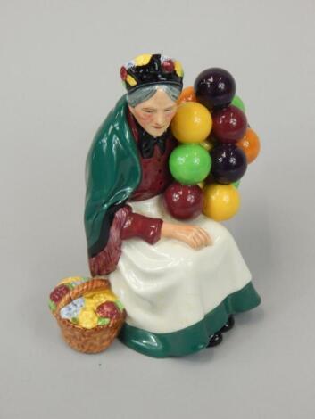 A Royal Doulton figure The Old Balloon Seller HN1315