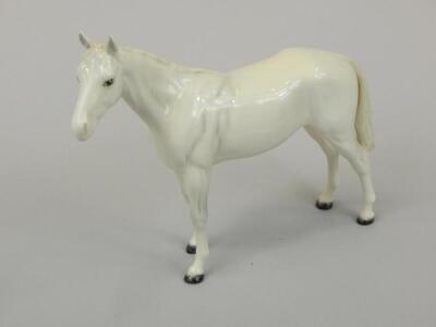 A Beswick figure of a standing horse in white