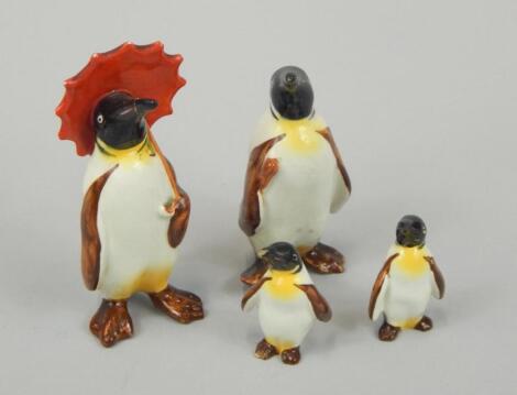 A Beswick figure of a penguin holding and umbrella