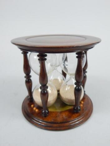 A modern mahogany finish three sectional egg timer