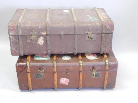 A vintage canvas brass and wooden trunk