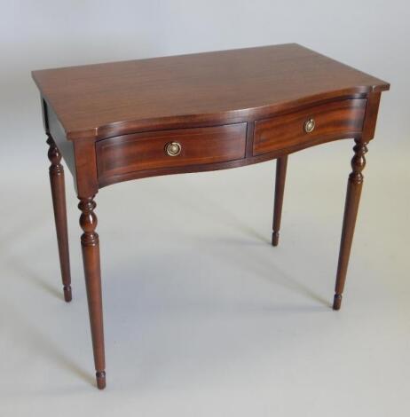 A reproduction mahogany side table