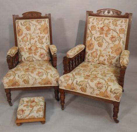 A pair of Victorian carved oak open armchairs