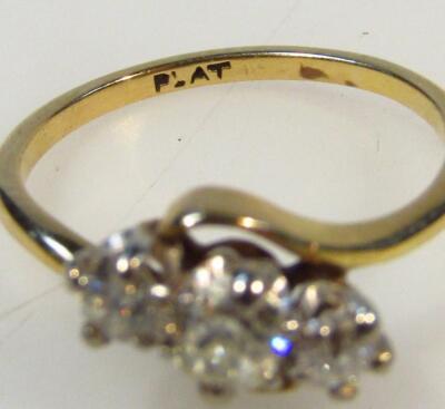 A yellow metal platinum and diamond three stone ring - 2