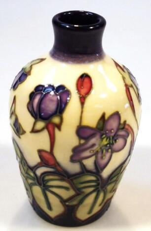 A Moorcroft Hepatica pattern vase by Emma Bossons