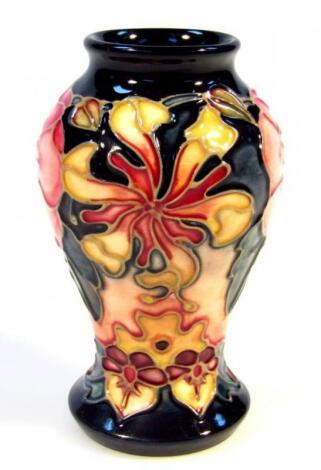 A Moorcroft pottery Honeysuckle pattern vase