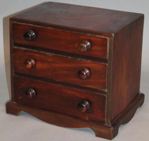 An early 19thC mahogany miniature chest