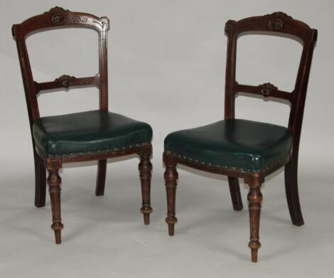 A pair of Edwardian walnut stained dining chairs