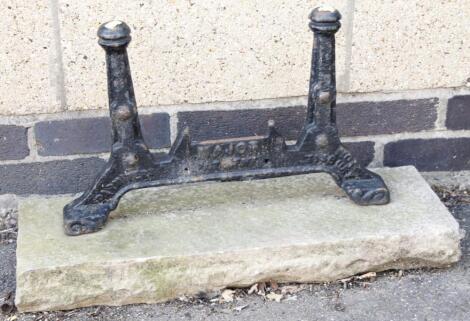 An early 20thC cast iron and free stone boot scraper