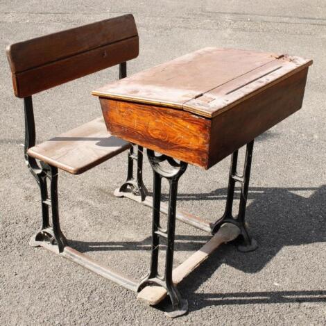 An early 20thC pine and metal frame school desk