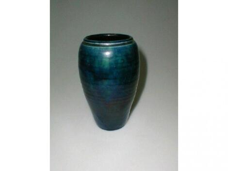 A Baron pottery vase, of ovoid form, decorated with a blue streaky glaze,