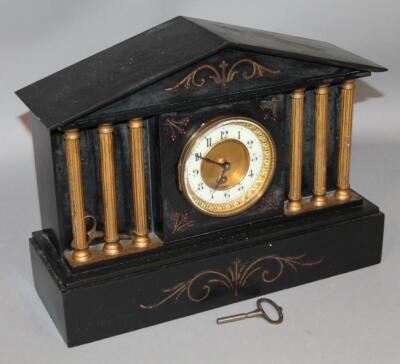 A Victorian black slate mantel clock