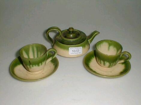 An Aller Vale Pottery Bachelor's teapot and two matching cups and saucers