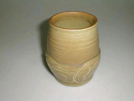 A Susie Cooper vase, of circular form, the lower body moulded and incised