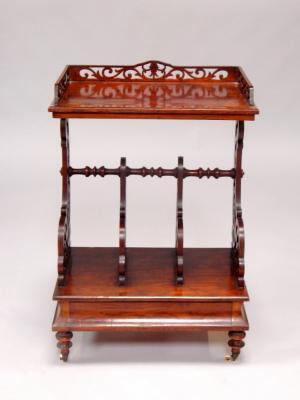 A Victorian walnut Canterbury whatnot