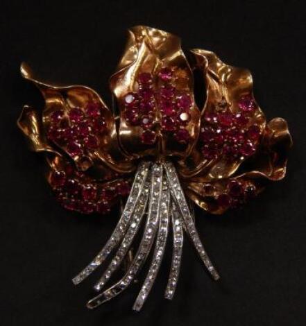 A Garrard yellow metal ruby and diamond flower brooch