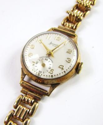 An Accurist 9ct gold bracelet watch