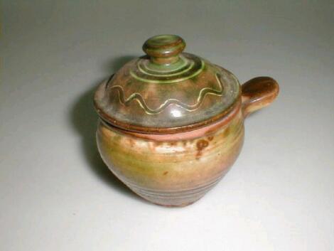 A Winchcombe pottery terracotta lidded pot