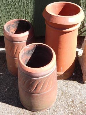 Three Victorian terracotta chimney pots