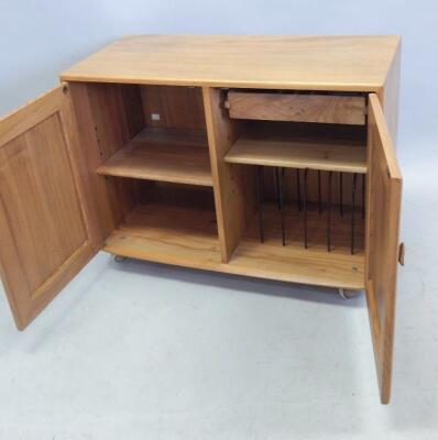 An Ercol light elm low cupboard - 2