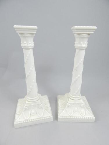 A pair of early 20thC Royal Worcester candlesticks