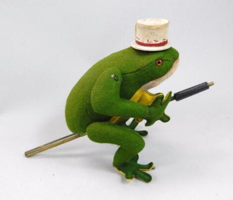 A mid 20thC GRDM velvet clockwork hopping toy frog