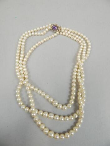 A three strand cultured pearl necklace