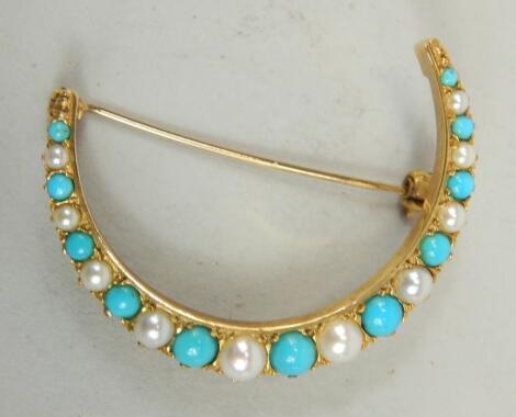A Victorian style crescent brooch