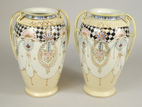 A pair of Japanese porcelain two handled vases