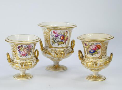 An early 19thC Derby porcelain garniture of campana urns