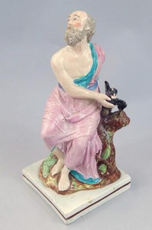 An early 19thC pearl ware figure of gentleman aside raven
