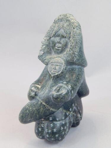 A polished stone Inuit carving