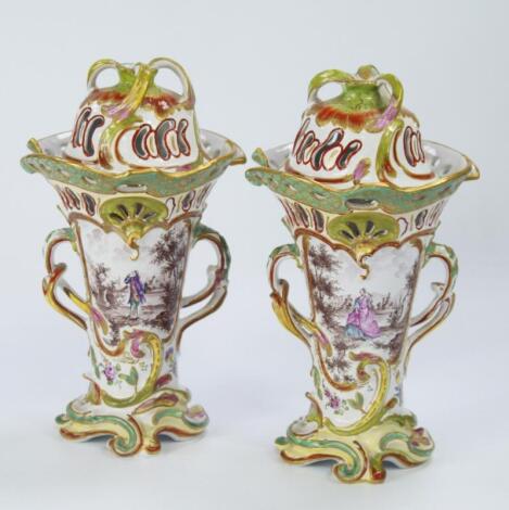 A pair of early 19thC French faience rococo vases and covers