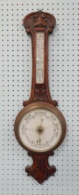 An Edwardian oak cased banjo aneroid barometer